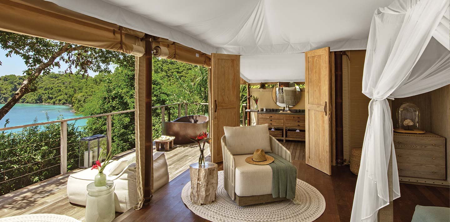 The luxury interior of a tented casita at Islas Secas resort, indoor seating opens onto a private balcony ensuring a stay that feels in the depths of nature | Islas Secas