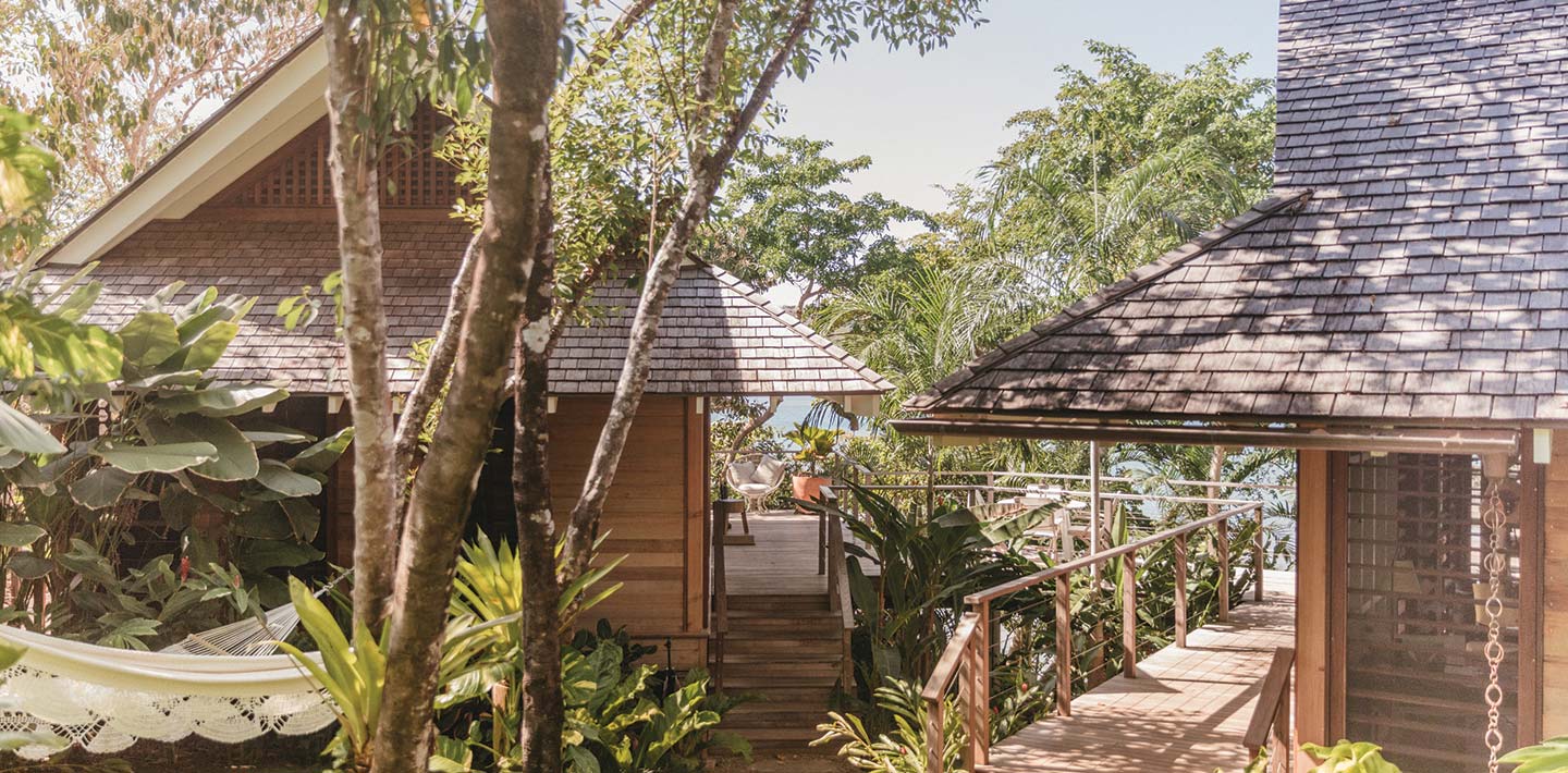 A view of the top floor balconies of Casita Sombras, which puts guests in the treetops of the surrounding nature | Islas Secas