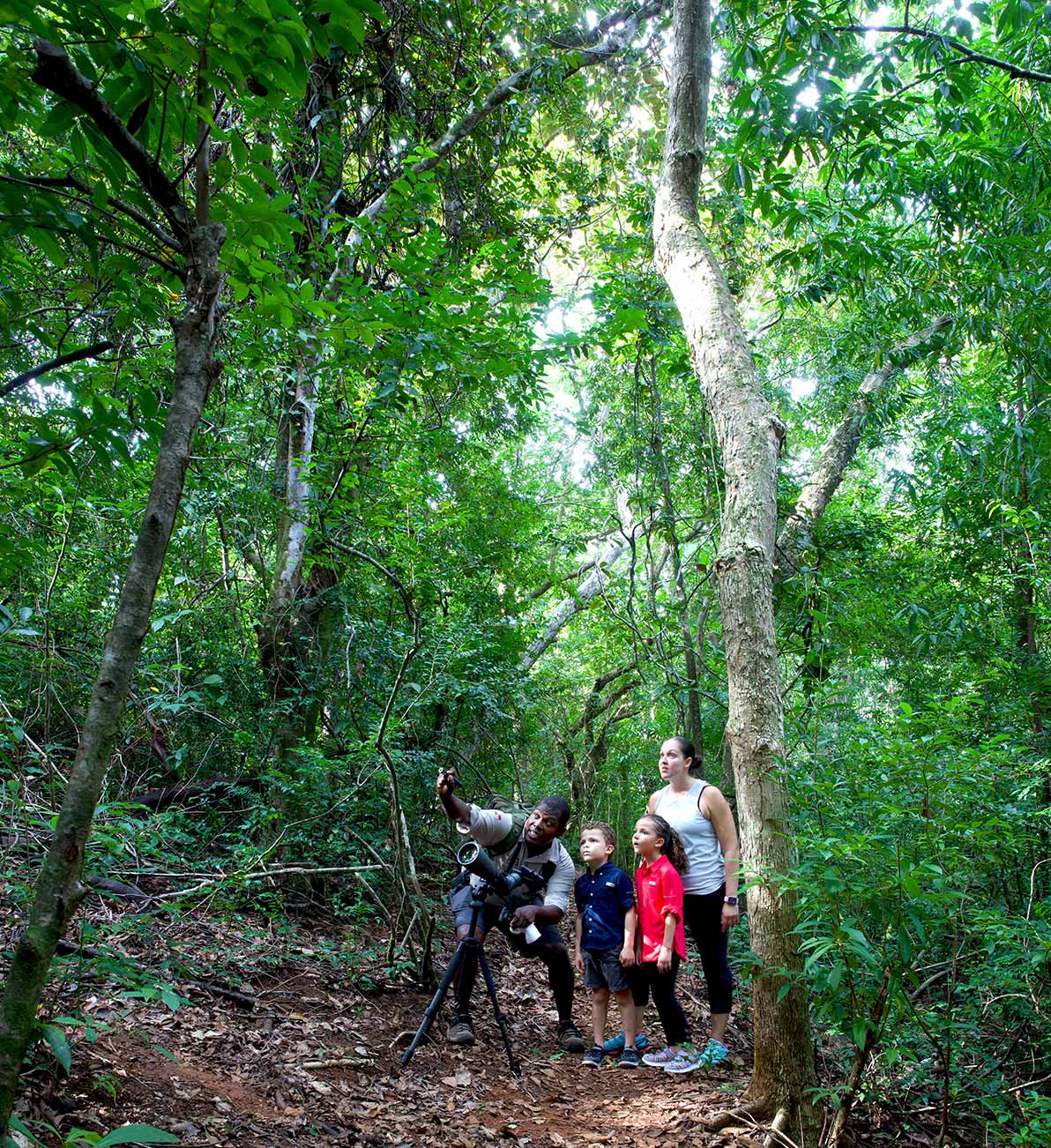 A guide enraptures a young family during one of the nature tours available at Islas Secas resort | Islas Secas