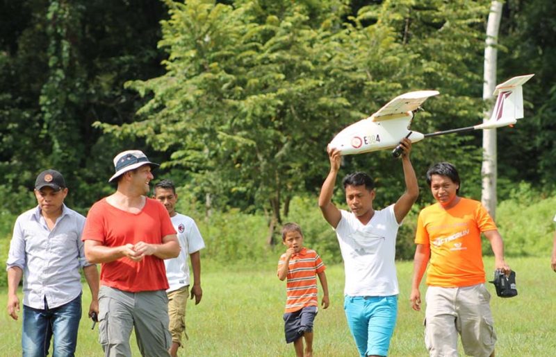 Local residents play with a remote control plane near Islas Secas resort 