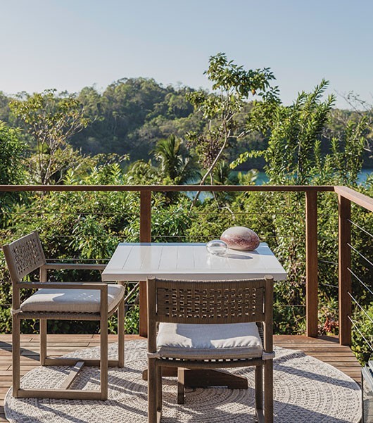 An outdoor table on the balcony of one of the Casitas at Islas Secas resort gives guests space to relax and enjoy refreshments from the privacy of their room | Islas Secas